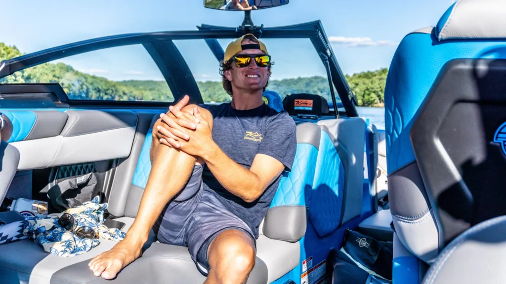 Hanging out on a Malibu wakeboat before a wakesurfing lesson